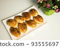 a variety of bakery on wooden plate 93555697
