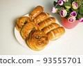 a variety of bakery on wooden plate 93555701