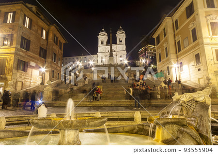 Rome Spanish Steps and Plaza de Espana at night crowded with tourists Rome Spanish Steps and Plaza de Espana at night crowded with tourists 93555904