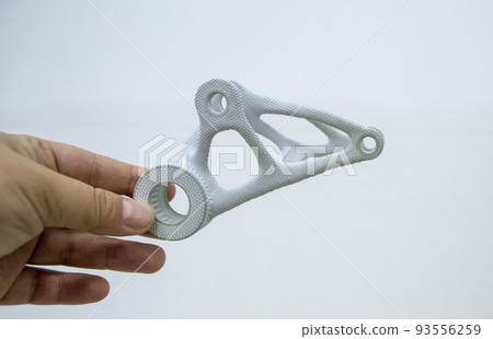 Person holding plastic model printed on powder 3d printer from biocompatible polyamide powder. Multi Jet Fusion MJF. New modern industrial 3D printing technology. Progressive additive technologies 93556259