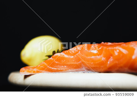 Fresh raw salmon fillet with seasonings and herbs 93559009