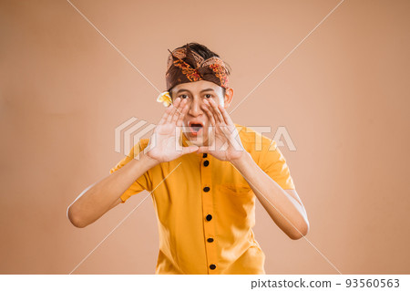 balinese male making announcement over isolated background balinese male making announcement over isolated background 93560563