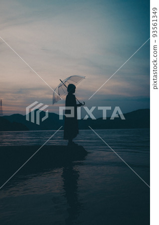 Female silhouette and beautiful sunset sky 93561349