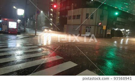 Rain wet intersection 93568941