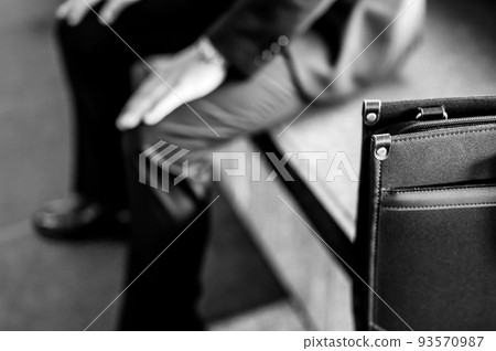 Depressed man holding his head businessman monochrome 93570987