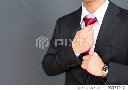 A businessman wearing a tie A businessman wearing a tie 93571042