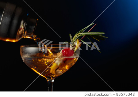 Cocktail with cherry, rosemary, and lemon. Cocktail with cherry, rosemary, and lemon. 93573348