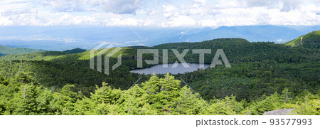 North Yatsugatake in summer, view from the summit of Takamiishi, overlooking Shirakoma Pond 93577993