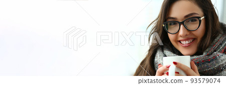 Beautiful girl is holding large cup in hands closeup Beautiful girl is holding large cup in hands closeup 93579074