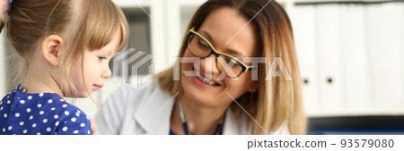 Little child girl at pediatrician appointment closeup Little child girl at pediatrician appointment closeup 93579080