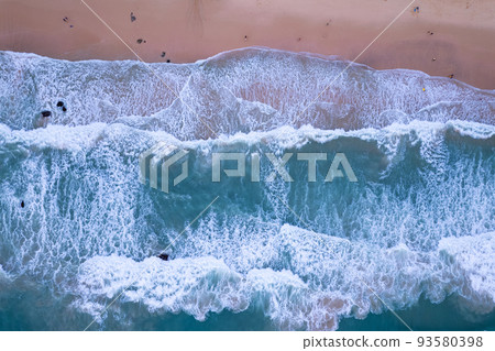 Aerial view sandy beach and big waves crashing on sandy shore, Beautiful tropical sea in the morning summer season image by Aerial view drone shot, high angle view Top down 93580398