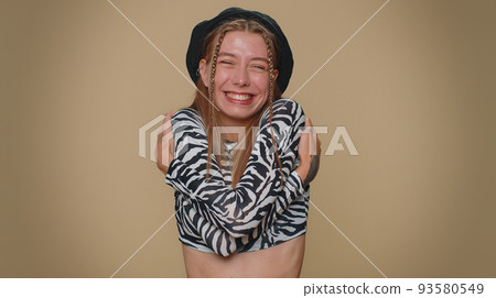 Pretty young woman spread hands and give hug to you, pleasant expression, love feelings, embrace 93580549
