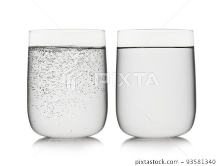 Sparkling mineral water and still water in large glass on white. Sparkling mineral water and still water in large glass on white. 93581340