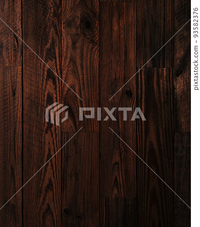 Background image of dark brown rough sawn timber plank wall 93582376