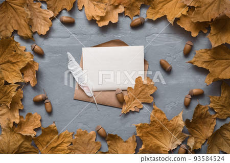 Autumn composition. Craft envelope. card mockup with autumn marple leaves. Flat lay, top view, copy space Autumn composition. Craft envelope. card mockup with autumn marple leaves. Flat lay, top view, copy space 93584524