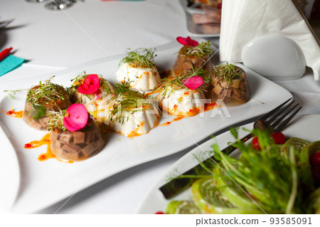 Calves-foot in the forms on the banquet table. Jellied meat on the table. Calves-foot in the forms on the banquet table. Jellied meat on the table. 93585091