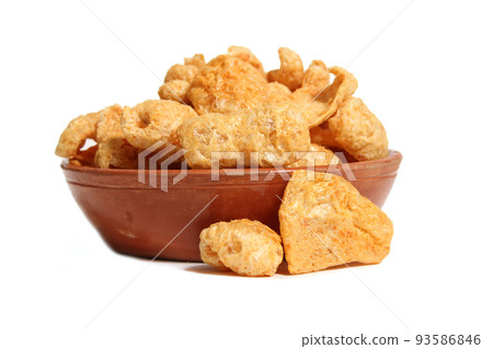 Bowl of Fried Pork Skins Isolated on White Background Bowl of Fried Pork Skins Isolated on White Background 93586846