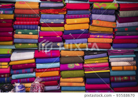 Artistic variety shade tone colors Saree's stacked on retail Shop Shelf to sale Artistic variety shade tone colors Saree's stacked on retail Shop Shelf to sale 93588670