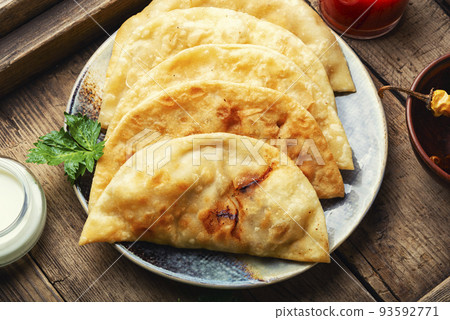 Homemade fried cheburek pies 93592771