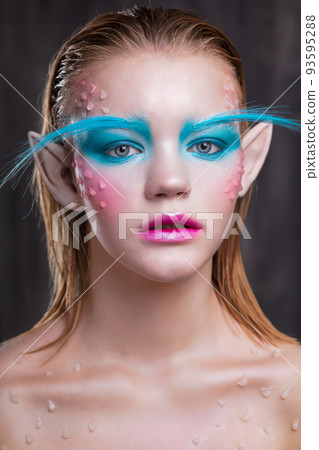 Young charming blonde with creative makeup 93595288