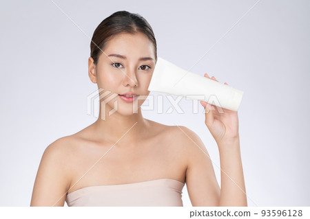 Gorgeous woman smiling holding mockup product for advertising text place. Gorgeous woman smiling holding mockup product for advertising text place. 93596128