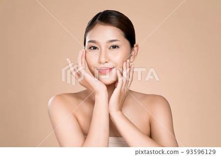 Portrait of ardent young woman posing beauty gesture with clean fresh skin. Portrait of ardent young woman posing beauty gesture with clean fresh skin. 93596129