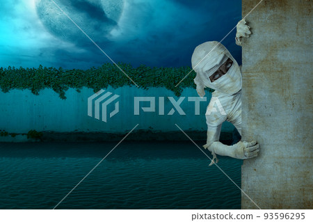 Mummy comes from behind the wall 93596295