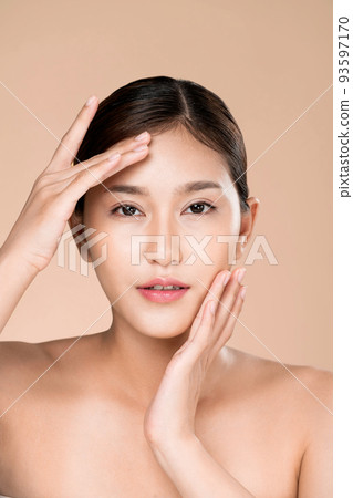 Closeup ardent young woman posing beauty gesture with clean fresh skin. 93597170