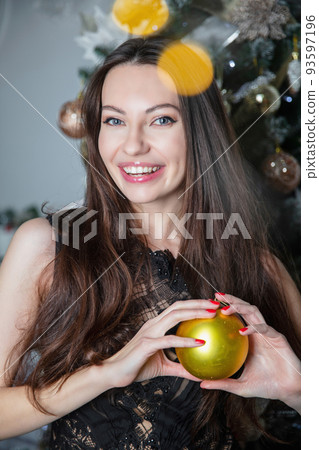 Happy woman wearing a evening dress 93597196