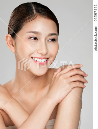 Portrait of ardent young woman posing beauty gesture with clean fresh skin. 93597331