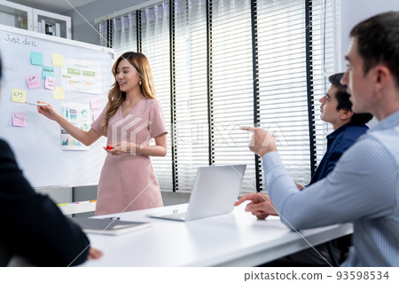 Competent office workers from various nationalities in the meeting room. 93598534