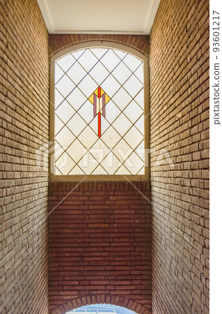 Close up of beautiful stained glass window with ornament and unusual shapes in luxury apartment 93601217