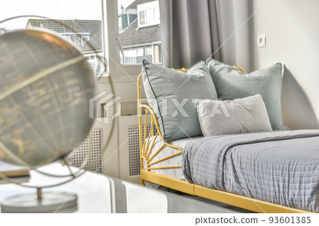 Home interior design of bedroom with bed and wooden wardrobe placed in corner near window in modern apartment Home interior design of bedroom with bed and wooden wardrobe placed in corner near window in modern apartment 93601385