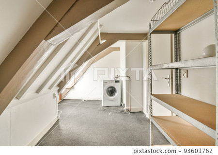Interior of modern bright laundry room with white walls and dark reflect floor Interior of modern bright laundry room with white walls and dark reflect floor 93601762