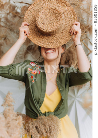 playful woman straw hat dry plants autumn 93601859