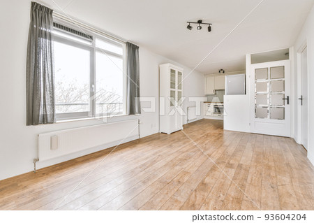 Interior of empty white kitchen with windows and wooden parquet floor 93604204
