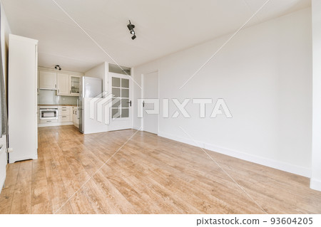 Interior of empty white kitchen with windows and wooden parquet floor 93604205