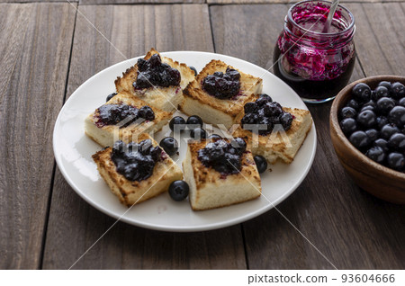 Blueberry jam spread on toasted bread Blueberry jam spread on toasted bread 93604666