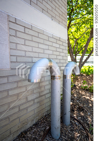 Curved ventilation pipe used to equalize pressure and provide air to an underground pumping wastewater sewage station. Curved ventilation pipe used to equalize pressure and provide air to an underground pumping wastewater sewage station. 93605050