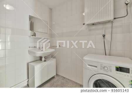 Sink base cabinet and mirror cabinet in white tiled bathroom with wall hung toilet 93605143