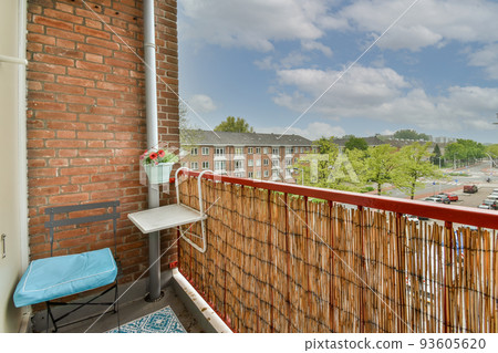 Sitting area in balcony with comfortable furniture around beautiful view Sitting area in balcony with comfortable furniture around beautiful view 93605620