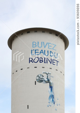 Water tower in Viriat with the slogan drink the tap water called buvez l'eau du robinet in french language, Bresse, France 93609898