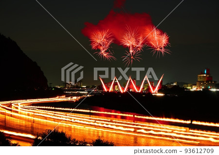 Light traces of bonfires of cormorant fishing on the Nagara River and fireworks on the Nagara River Light traces of bonfires of cormorant fishing on the Nagara River and fireworks on the Nagara River 93612709