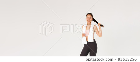 Sport, gym and healthy body concept. Full length of healthy and active, smiling asian fitness girl, brunette female athlete, wiping sweat with towel after good workout, training session in gym 93615250