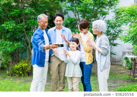 Three generation family close portrait 93620558