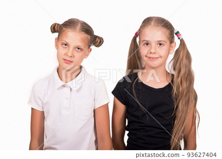 Girlfriends. Cute happy girls in black and white t-shirt on a white background. 93627404