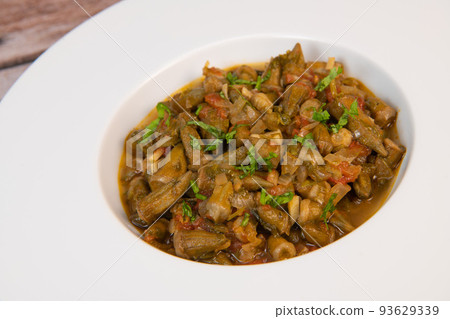 Bhindi masala or ladies finger fry served with indian roti chapati or Indian Flat bread Bhindi masala or ladies finger fry served with indian roti chapati or Indian Flat bread 93629339