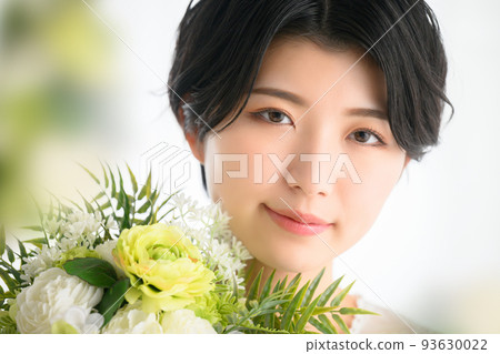 A woman surrounded by beautiful flowers, perfect for weddings, etc. 93630022