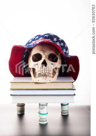 Skull on books and money. Skull in Panama. Panama in the form of the American flag. Skull on books and money. Skull in Panama. Panama in the form of the American flag. 93630763