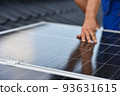 Rooftop solar power system. Process of installing solar panels on the roof of a house. Green energy 93631615